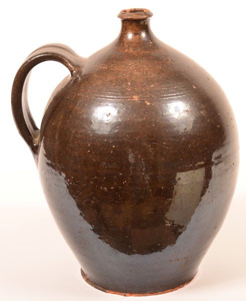 Large Manganese Glazed Redware Pottery Jug. (1 of 3)