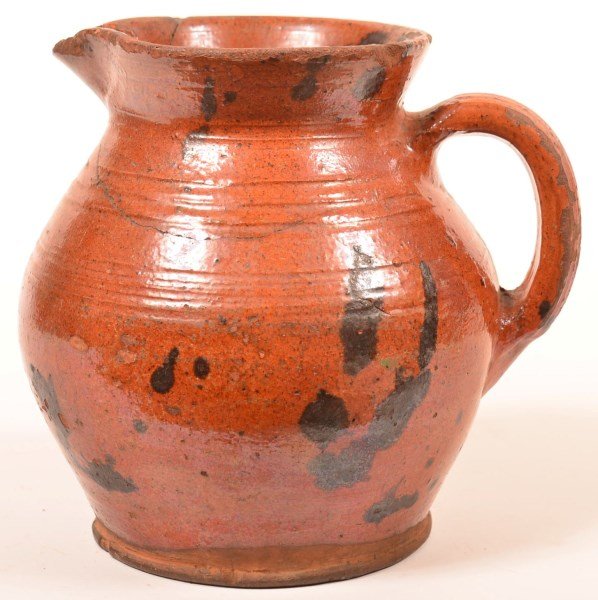 Mottle Glazed Redware Pottery Pitcher. (1 of 3)