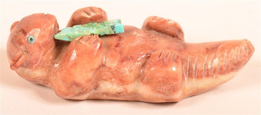 Navajo Folk Art: Otter Fetish by Julia Norton. Turquoise eyes, floting on back with turquoise fish dinner on its belly. 1.3"W x 3.1" L.