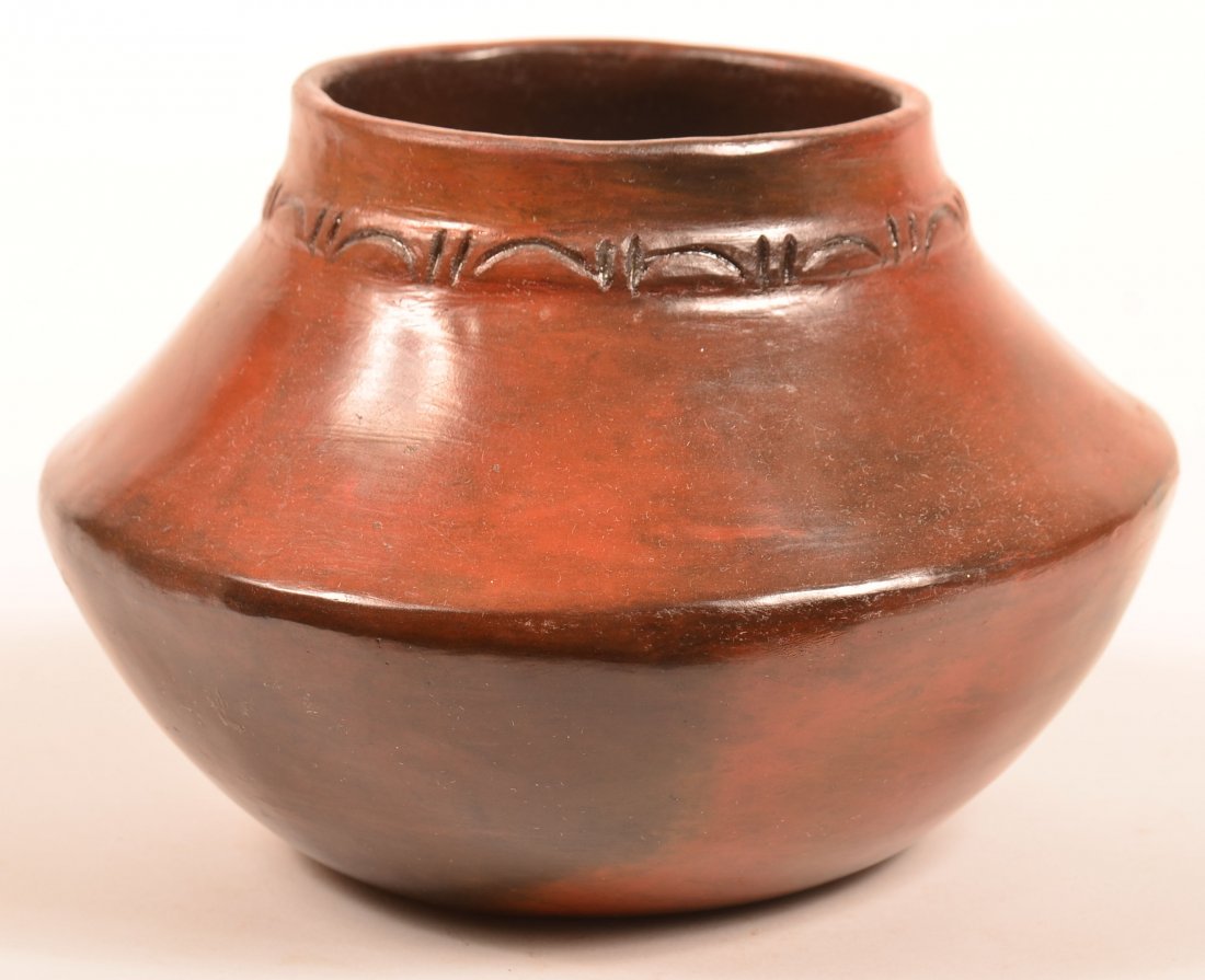 Navajo Pottery Olla by Rose Williams: Reddish brown to black glaze. Neck ring decoration. Signed RW. Rose is one of the matriarchs of Navajo pottery. From Twin Rocks T.P.,Bluff, UT. 5.4"H x 8"D. (SPAZ-p.101,104;TPS-p.6,14, 18,71,124,147;a