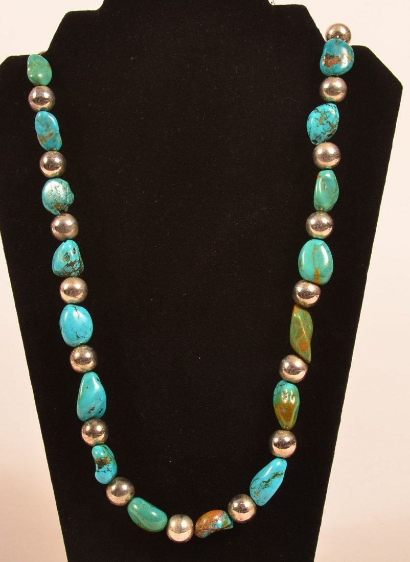 33" Necklace: with 26 silver balls and 27 turquiose nuggets