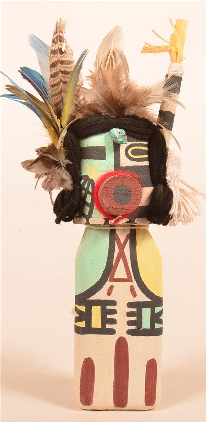 Hopi Old Style Dancer Kachina: Half clawn & half corn by Bertram Tsavadawa who is featured in Jonathan Day's books THK 0.99. It is signed on the bottom BT and has a turquoise nugget on his forehead. 10"Hx3"W
