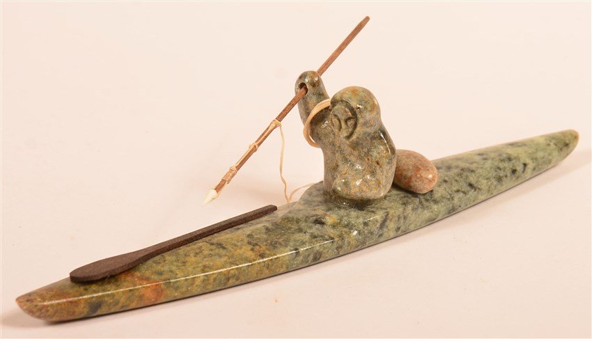 Soapstone Carving: of Eskimo Whale Hunter in his Kayak. Signed Chuck. 8"L.