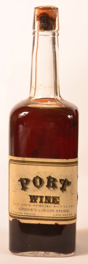 Grove's Liquor Store, Filled Wine, Lanc., PA.: Grove's Liquor Store, 15 Centre Square, Lancaster, PA, Filled Port Wine Bottle, "My Own Special Bottling." Paper Label on Clear Bottle, 11 1/2" tall. Tax Stamp Attached. Condition: Good, with Minor La