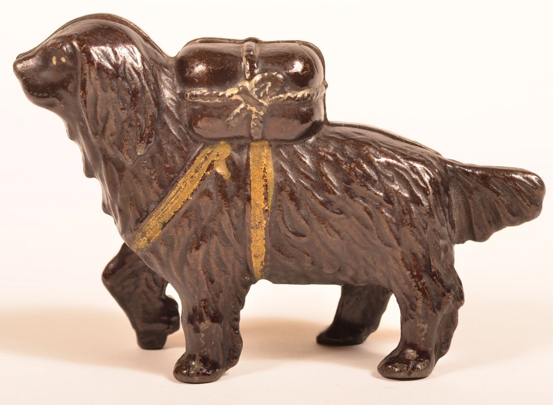Saint Bernard Iron Still Bank by A.C. Williams.: Small Saint Bernard with Pack Case Iron Still Bank by A.C. Williams. Circa 1905-1930's. 5-1/2"l. Condition: Very good with minor paint wear.