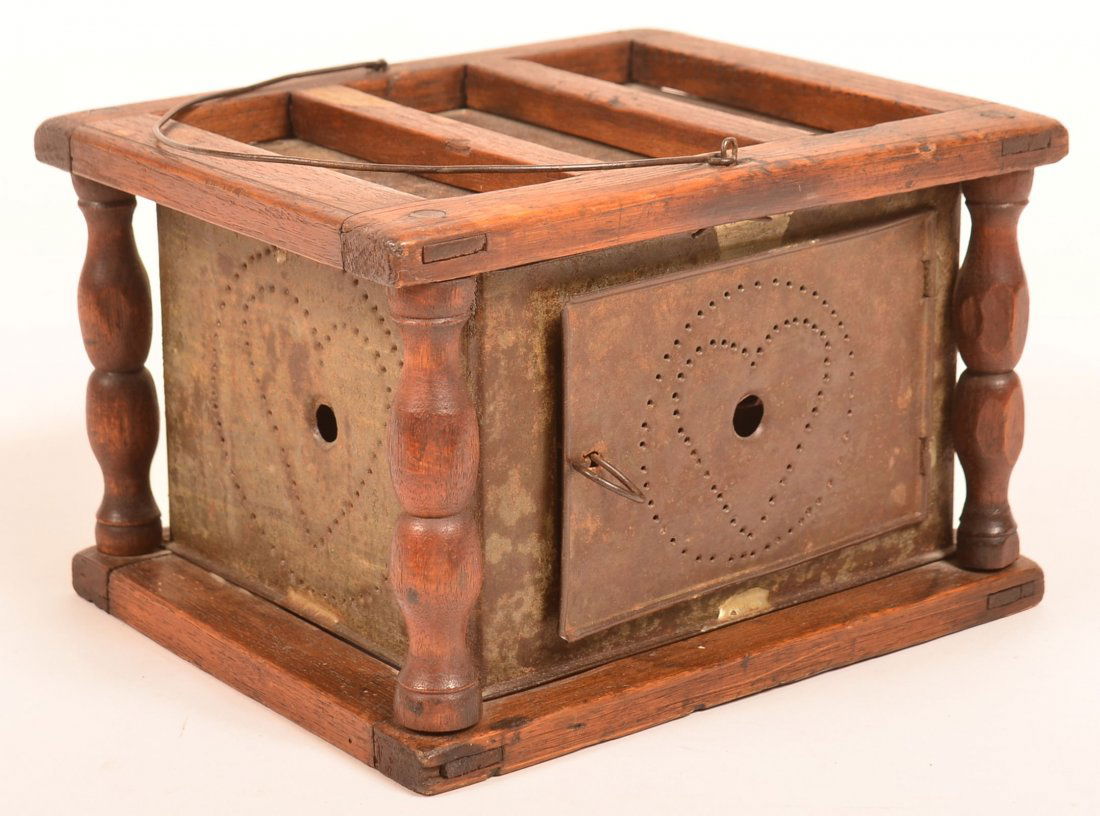 Early Punch Tin and Walnut Foot Warmer.: Pennsylvania Early 19th Century Punch Tin and Walnut Foot Warmer. Mortise and peg construction with turned corner posts, wire bale handle, heart in circle punch tin sides, interior with period coal tr