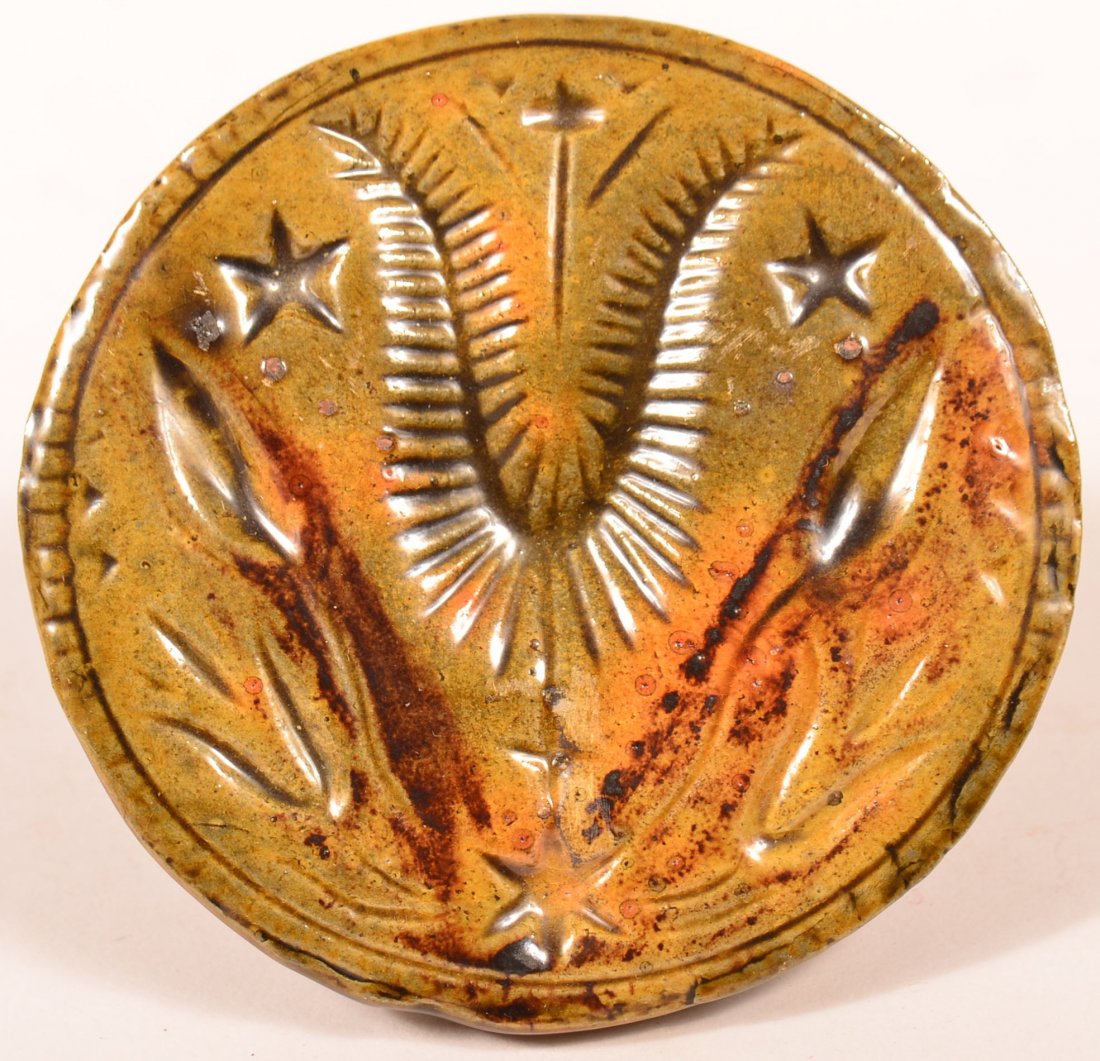 Breininger Redware Butter Printed 1974: Breininger Redware Butter Printed 1974. Incised tulip and star decoration. 3'h x 4" dia. Condition: Very good.