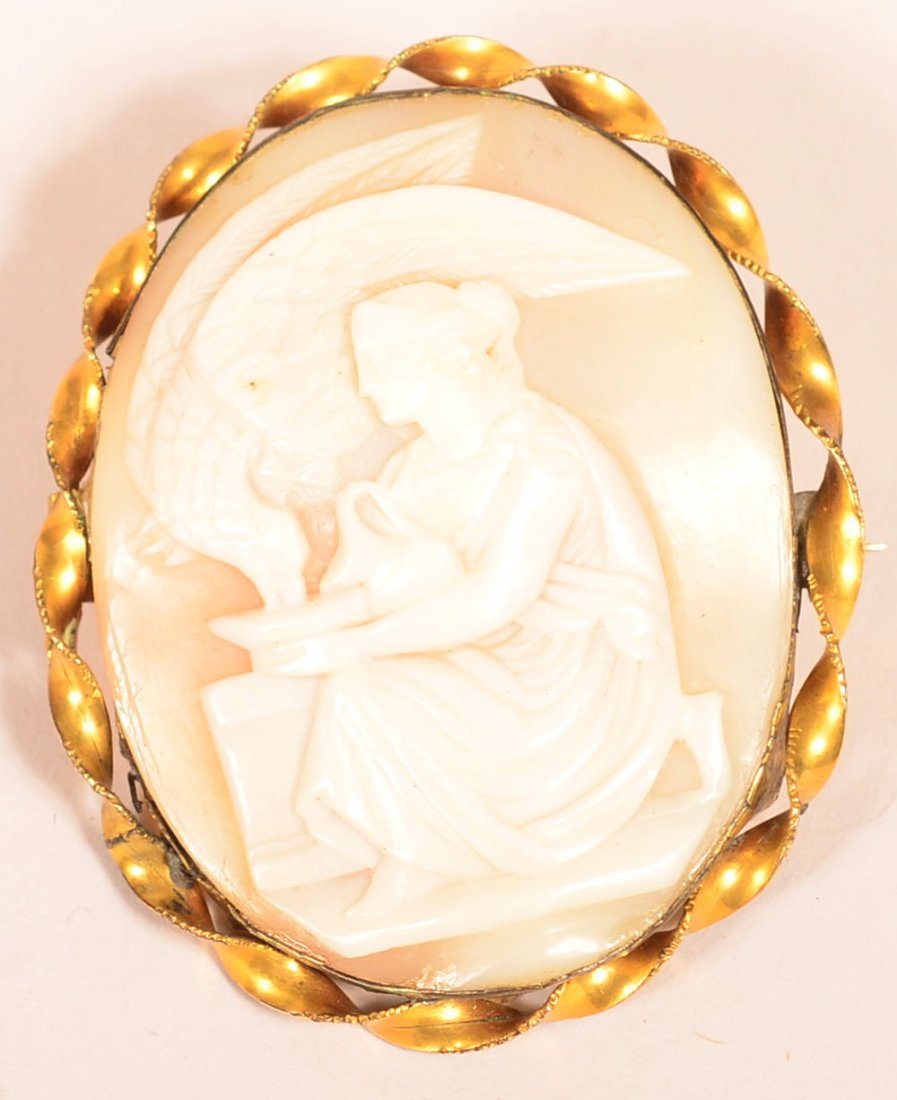 Shell Cameo Pin with Woman and Eagle.: Victorian Shell Cameo Pin with Woman and Eagle. Superior quality carving, gold filled frame. 2-1/4" high overall. Condition: Very good with old fitting repair.