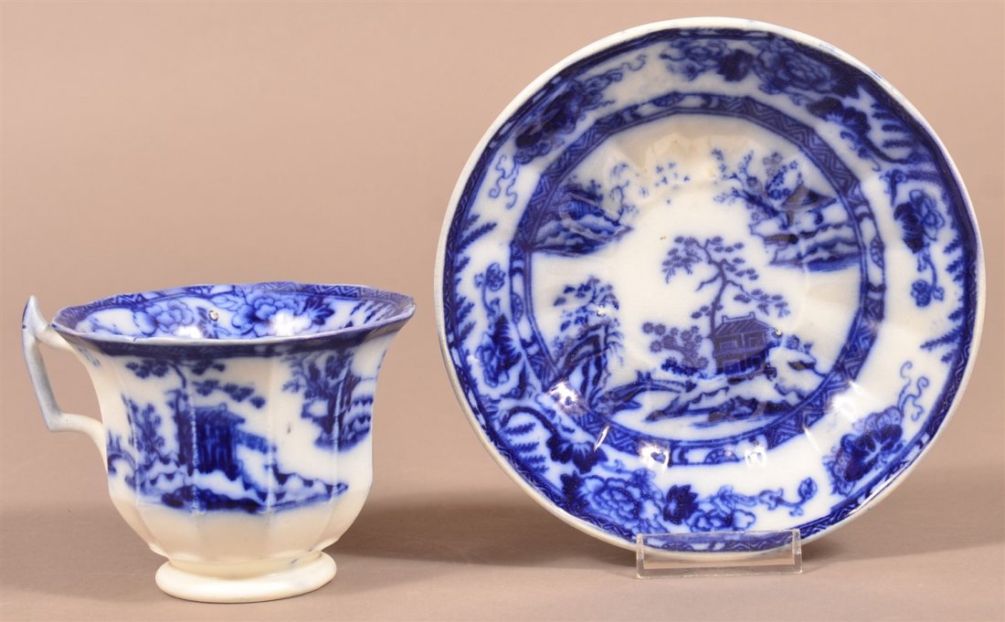 Flo Blue Ironstone China "Hong Kong" Large C/S: Flo Blue Transfer Ironstone China "Hong Kong" Pattern Oversized Cup and Saucer. 6 1/2"diam. Condition: Chip repairs to both items.