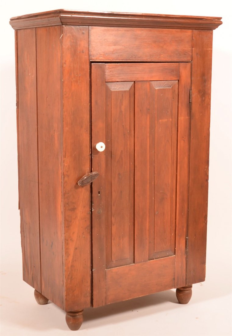 Pennsylvania Softwood Milk Cupboard.: Pennsylvania Softwood Milk Cupboard. Molded cornice, single paneled door, interior shelves, turned feet. 53-1/2"h. x 32-1/4"w. x 19-3/4"d. Condition: Good with old refinish, wear and losses, back was 