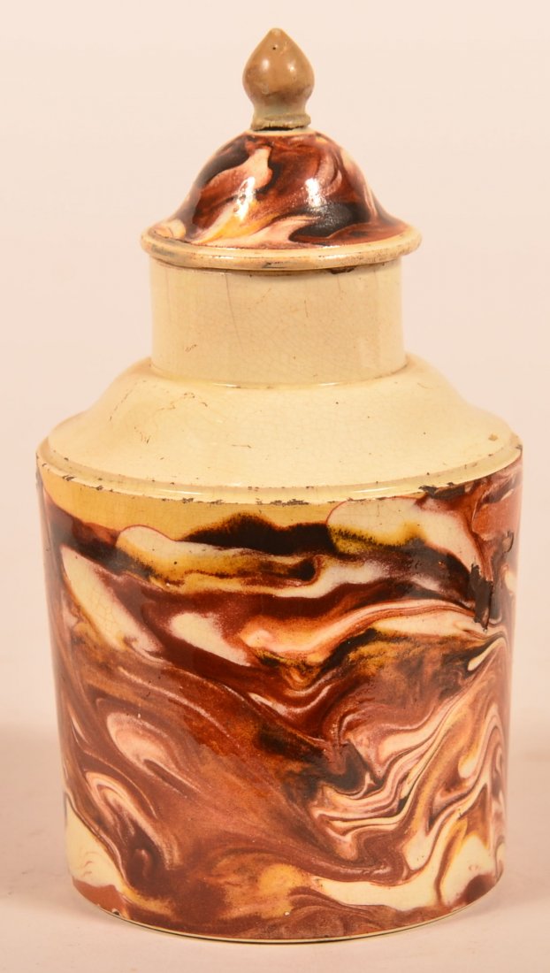 Marblized Mocha Creamware Pottery Tea Caddy.: Marblized Mocha Creamware Pottery Tea Caddy. Dome lid with cylindrical collar, ogee shoulder and cylindrical base. 4-3/4"h. Condition: Fair, lid damaged, chips and hairline on base.