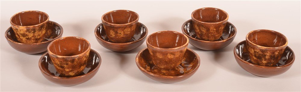 Six Breininger 1973 Cups and Saucers: Six Breininger 1973 Cups and Saucers. Saucers 5 1/4"diam. Cups 2 1/2"h. Condition: Very good with chip on rim to one saucer.