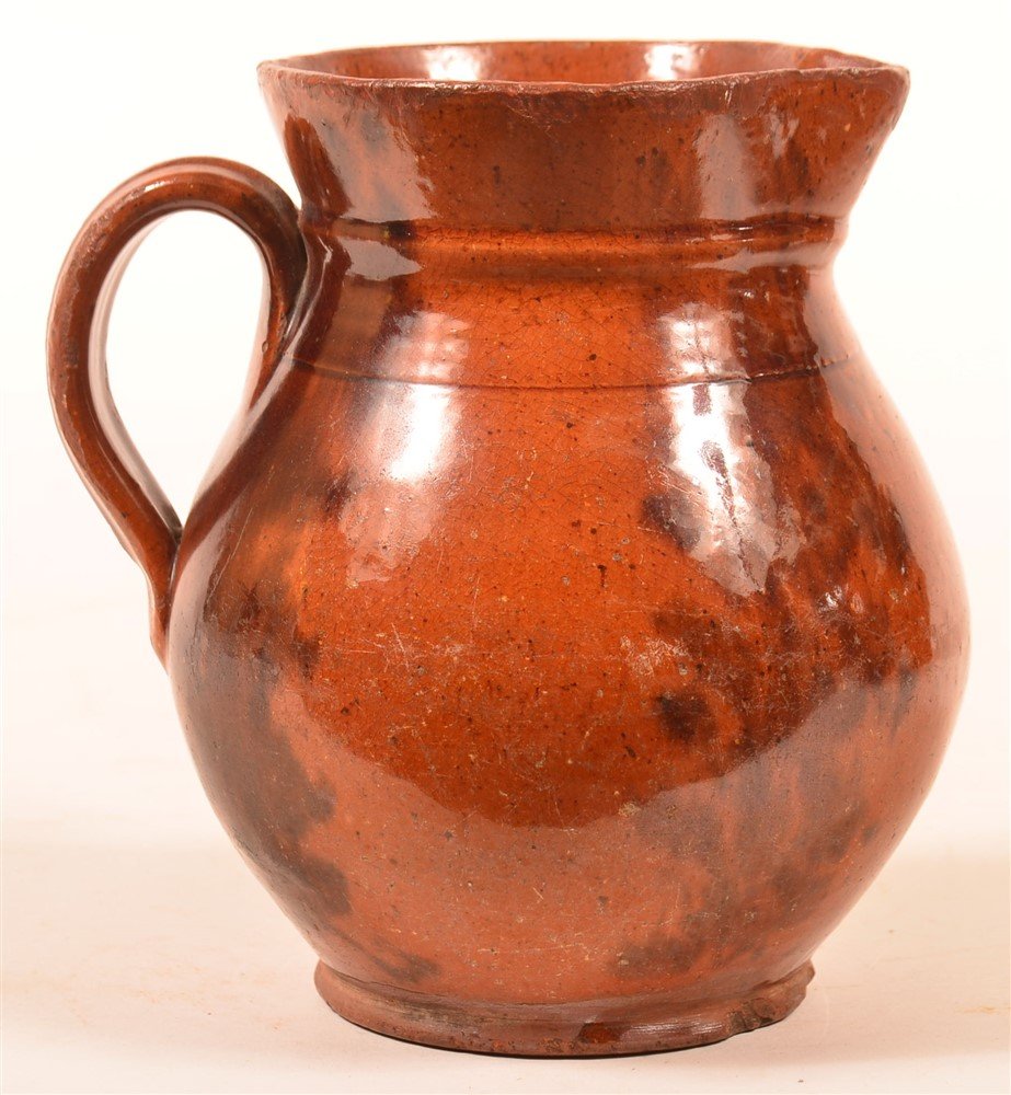 Redware Mottle Glazed Pottery Pitcher. (1 of 3)