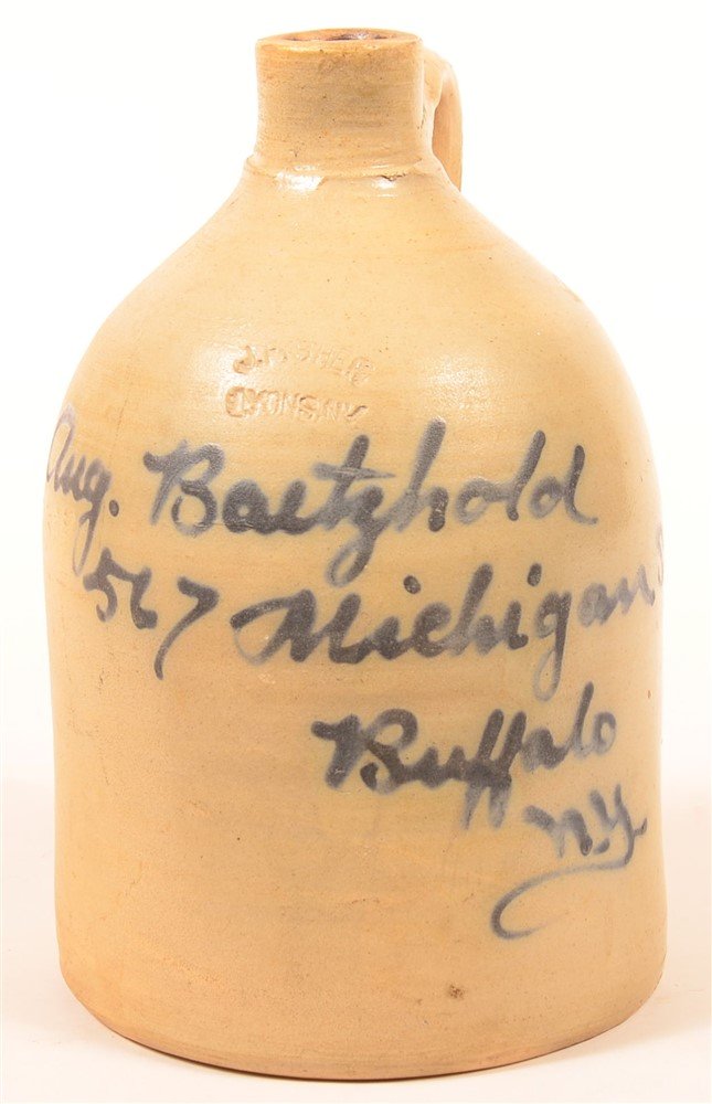 J. Fisher Evans, NY One Gallon Advertising Jug.: J. Fisher Evans, NY One Gallon Blue Slip Script Advertising Jug. Signed "Aug. Bartzhold, 567 Michigan St. Buffalo N.Y. 11"h. Condition: Good, minor chips on base.
