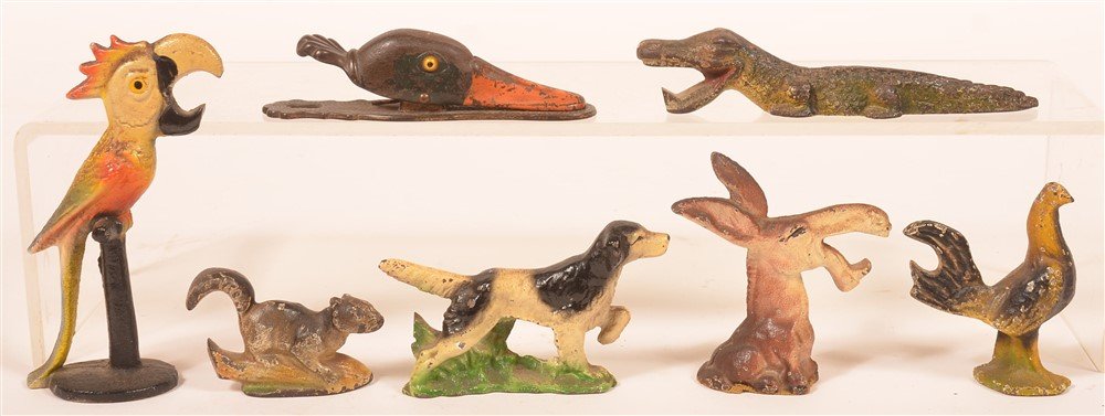 Seven Cast Iron Items. (1 of 2)