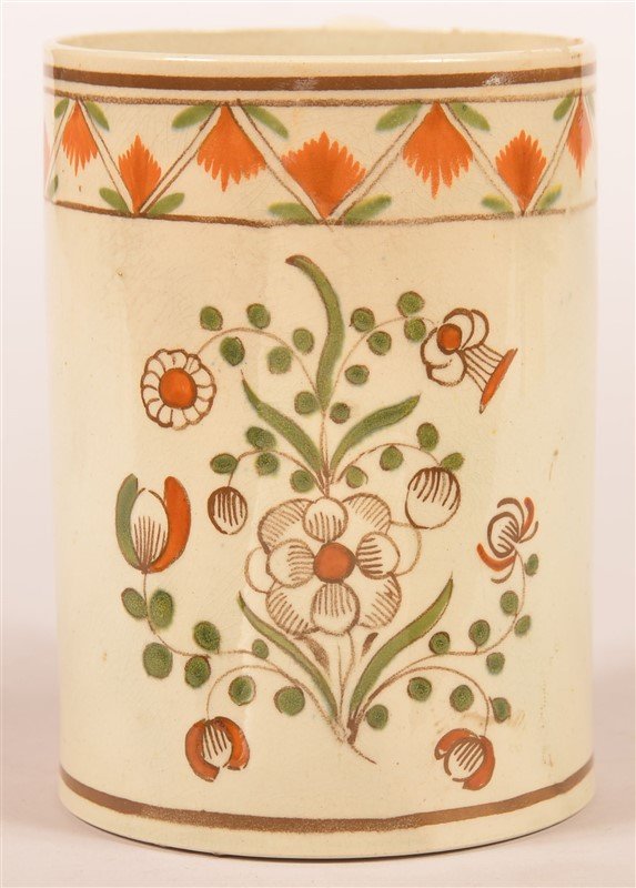 Leeds Soft Paste China Mug.: Leeds Soft Paste China Mug with Floral and Foliate Decoration. 4-3/4"h. Condition: Good with pin nip on inside of upper rim, small hit hairline on base.