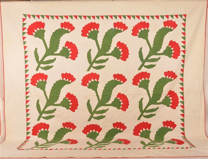 Red and Green Applique Patchwork Quilt.: Antique Red and Green Floral Applique Patchwork Quilt. Saw tooth border. 89" x 90-1/2". Condition: Good with minor staining and fading.