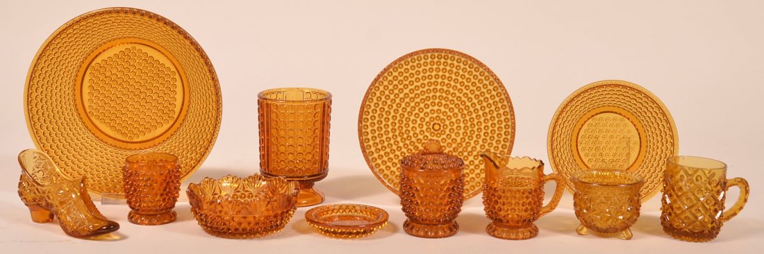 Lot of Amber Pattern Glassware.: Lot of Amber Hobnail and Daisy and Button Pattern Glassware. Condition: Good with wear.