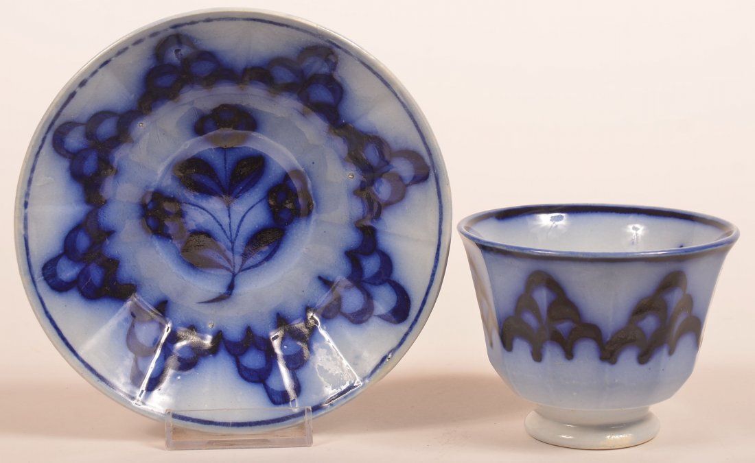 Flow Blue Skeleton Leaf Cup and Saucer. (1 of 2)