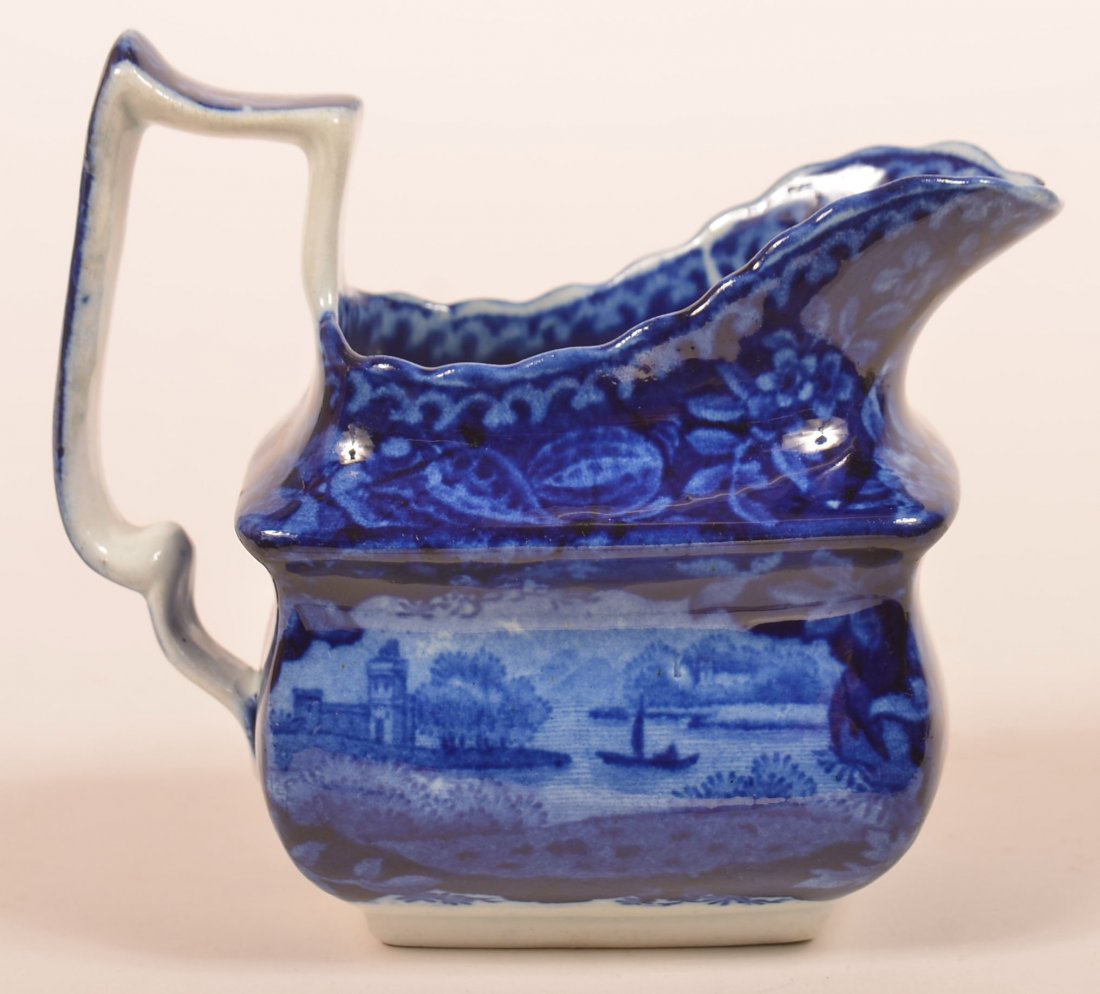 Staffordshire Blue Transfer China Creamer.: Staffordshire Blue Transfer China Cream Pitcher. Helmet form with boating and castle views. 4-3/4"h. Condition: Very good.