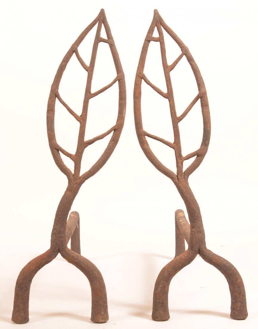 Pair of Iron Leaf Form Andirons.: Pair of Iron Leaf Form Andirons. 24"h. x 22-1/2"l. Condition: Good with pitting and rust.