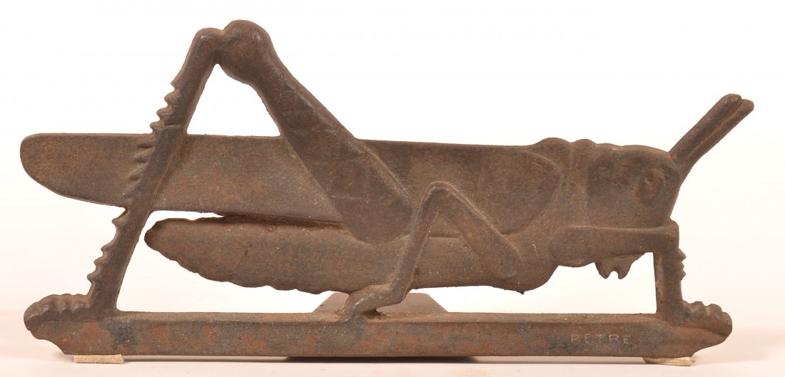 Cast Iron Grasshopper Doorstop Signed "Petre".: Cast Iron Grasshopper Doorstop Signed "Petre". 15"l. Condition: Good with some rust and pitting.