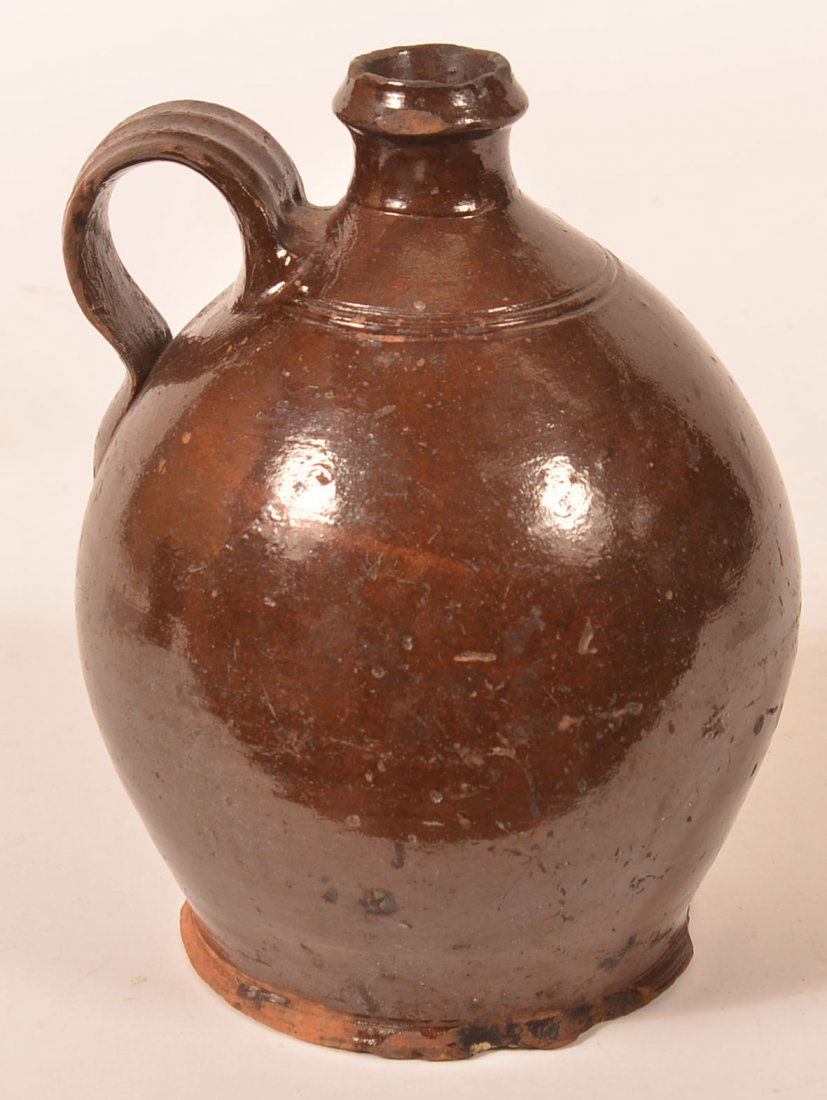 Pennsylvania 19th Century Glazed Redware Jug. (1 of 2)