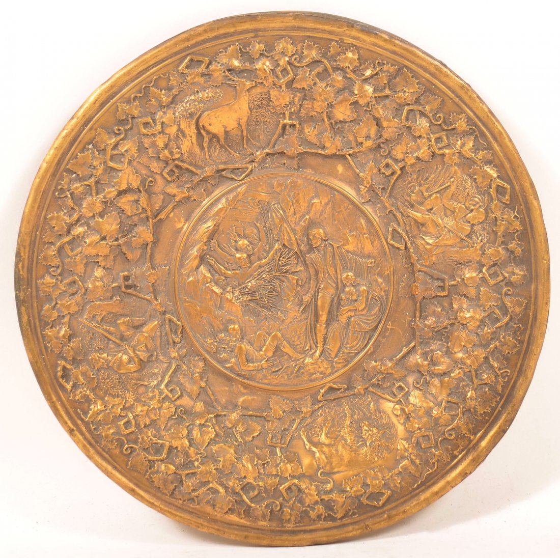 19th Century brass Plate with Embossed Scenes.: 19th Century brass Plate with Embossed Scenes. Colonial figure with Indians attacking, and other various border scenes. 10" diam. Along with a frame. Condition: Good wit some minor corrosion holes.
