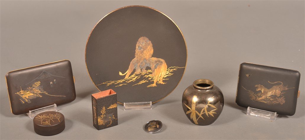 Seven Pieces of Japanese Damascened Steel.: Seven Pieces of Japanese Antique and Vintage Damascened Steel. Including a small vase pill box, cigarette cases, matchbox, pendant, and a small plate. Condition: Good with minor wear.