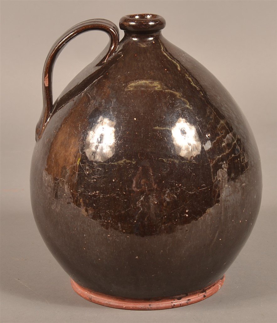 Manganese Glazed Redware Bulbous Form Jug. (1 of 2)
