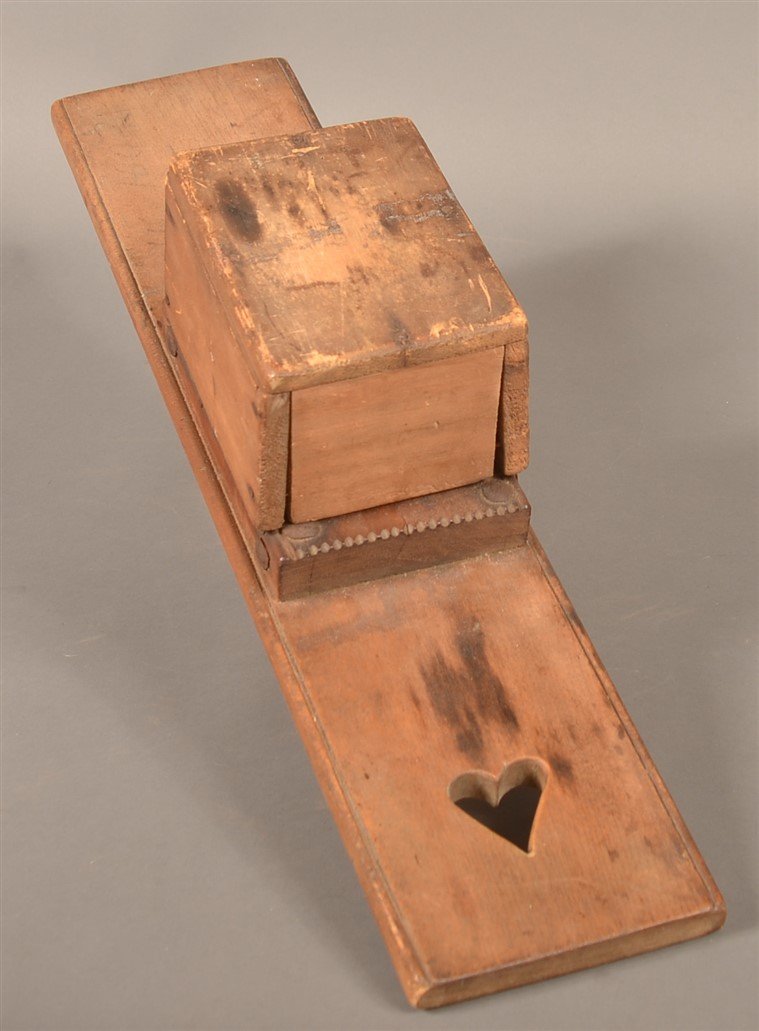 Pennsylvania Early 19th Century Hatchel.: Pennsylvania Early 19th Century Hatchel. Box cover, heart cut out. 24-1/4"l. Condition: Good with wear and stains.