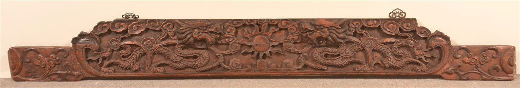Chinese Carved Camphor Wood Headboard Crest.: Antique Chinese Carved Camphor Wood Headboard Crest. Ornately relief carved with dragon, sun and cloud motifs. Old red finish. 85"w. Condition: Good with minor wear.