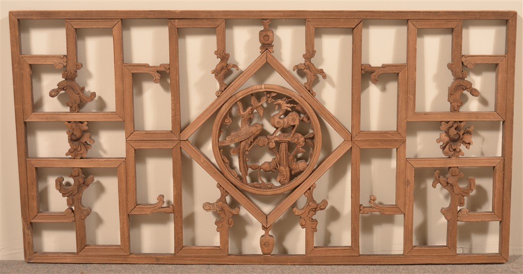 Chinese Carved Camphor Wood Window.: Mid 19th Century Chinese Carved Camphor Wood Window. Central medallion with deer, fish, phoenix and dragon carvings. 22" x 43". Condition: Good with wear.