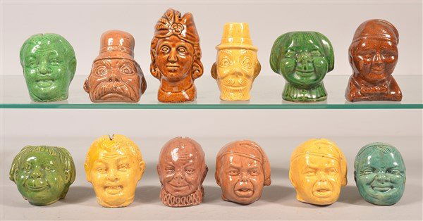 Twelve Pottery Figural Bust Still Banks. (1 of 3)