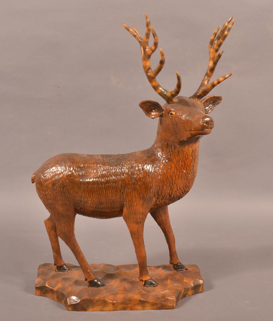 Vintage Folk Art Carved Wood Stag.: Vintage Folk Art Carved Wood Stag. Lacquered finish with smoke decorated antlers. 19"h. Condition: Good with minor wear.