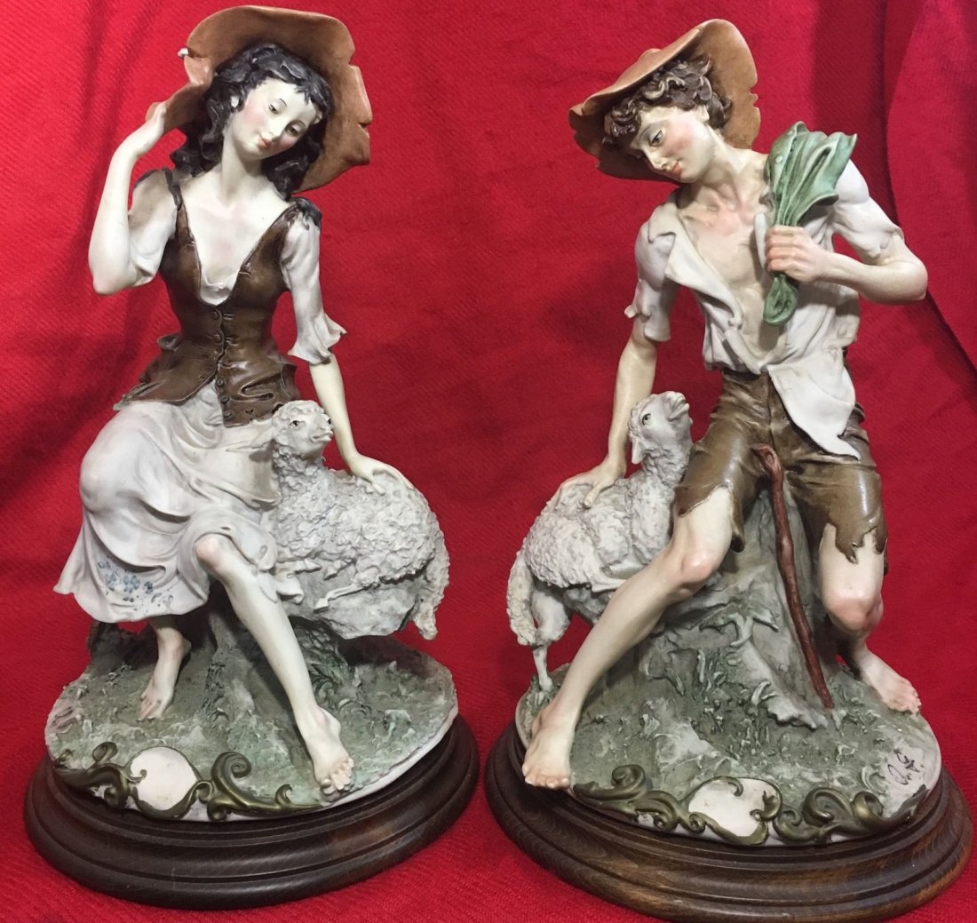 GIUSEPPE ARMANI ITALIAN PORCELAIN PAIR WITH LAMB 13": Two Giuseppe Armani Limited addition figurines for a boy and girl each with a sheep. Amazing rich details with beautiful colors. Both pieces are signed and marked with Giuseppe Armani famous (N)No box