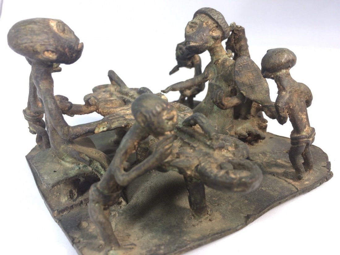 Antique grouping cast iron/Bronze African family: Antique grouping cast iron/Bronze figure African Miniatures Of Family Eating A Meal. Contains of 7 detailed figuresWe assume it's from 1800's, 4" High and 4 1/2" Wide. Shipping cost for this item with