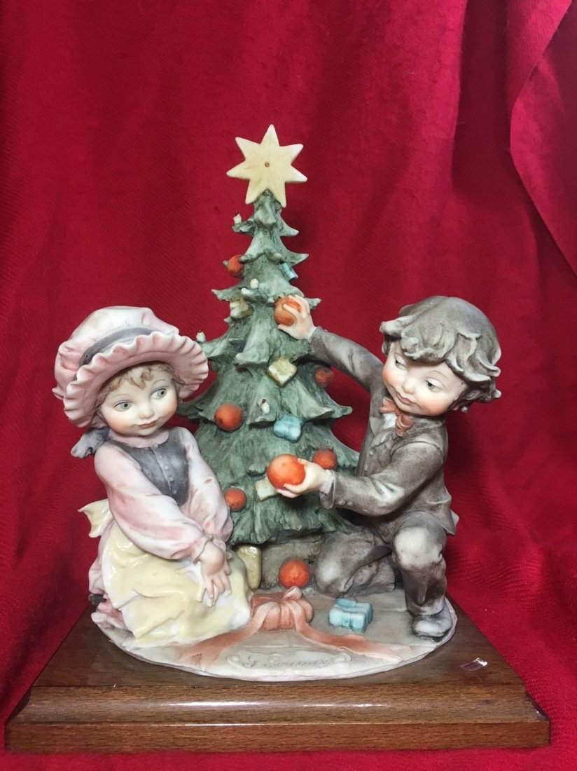 Giuseppe Armani Christmas Tree Boy&Girl: Giuseppe Armani Christmas Figurine Boy Girl Christmas Tree Rare Italy Excellent measures little over 9" in height and 8" in width.Shipping cost for this item within the USA is $30