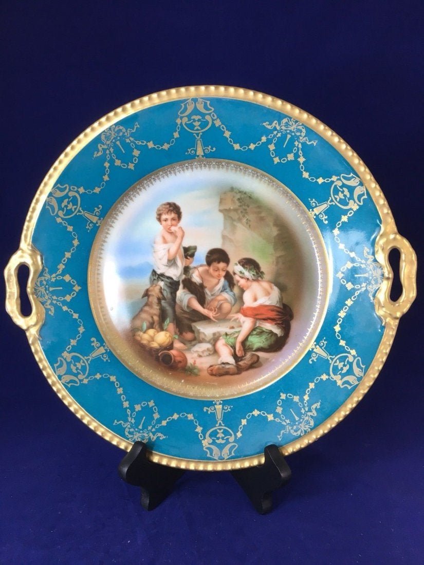 Antique Royal Schwarzburg China Cake Serving Plate Hand: Antique Royal Schwarzburg China Cake Serving Plate Hand painted 11 1/2”. A scene of dog and a dice game. Local shipping cost is $20