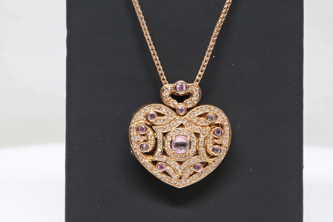 18k Estate Jewely "Kronen": 18k Estate Jewelry Heart Locket., Marked "Kronen" with diamonds and pink sapphire., 18k Rose Gold. 21.2g The heart locket is in excellent condition it open perfect.