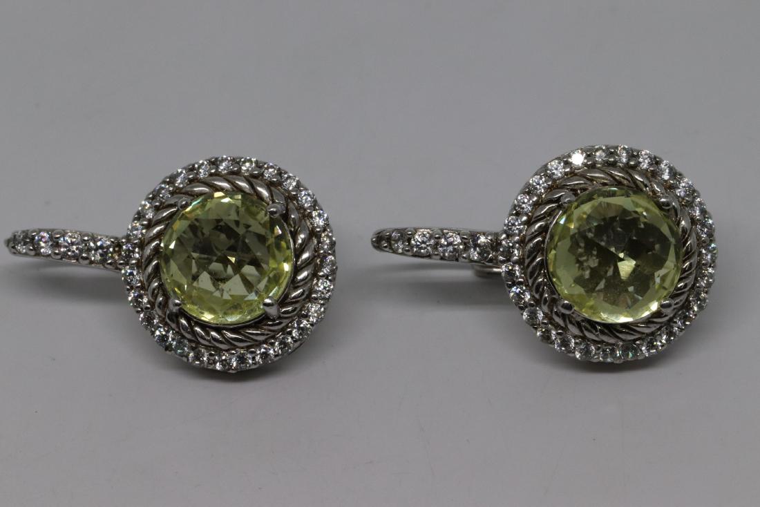 Judith Ripka Earrings: A Judith Ripka Earrings. These are a pair .925 silver earrings signed and marked "Judith Ripka .925 silver". The earrings are in very good condition. Total weight is 12.4g.