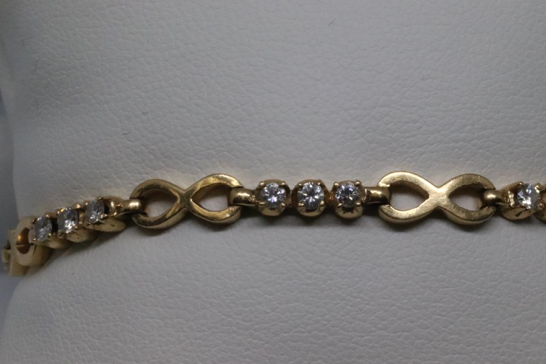 18k Diamond Bracalet: Gorgeous 18 karat yellow gold diamond bracalet. The bracalet has a total of 21 round brilliant diamonds. The weight of the diamonds are approx 1.00tcw. The clarity VS2-SI1, color are F-G color. The br