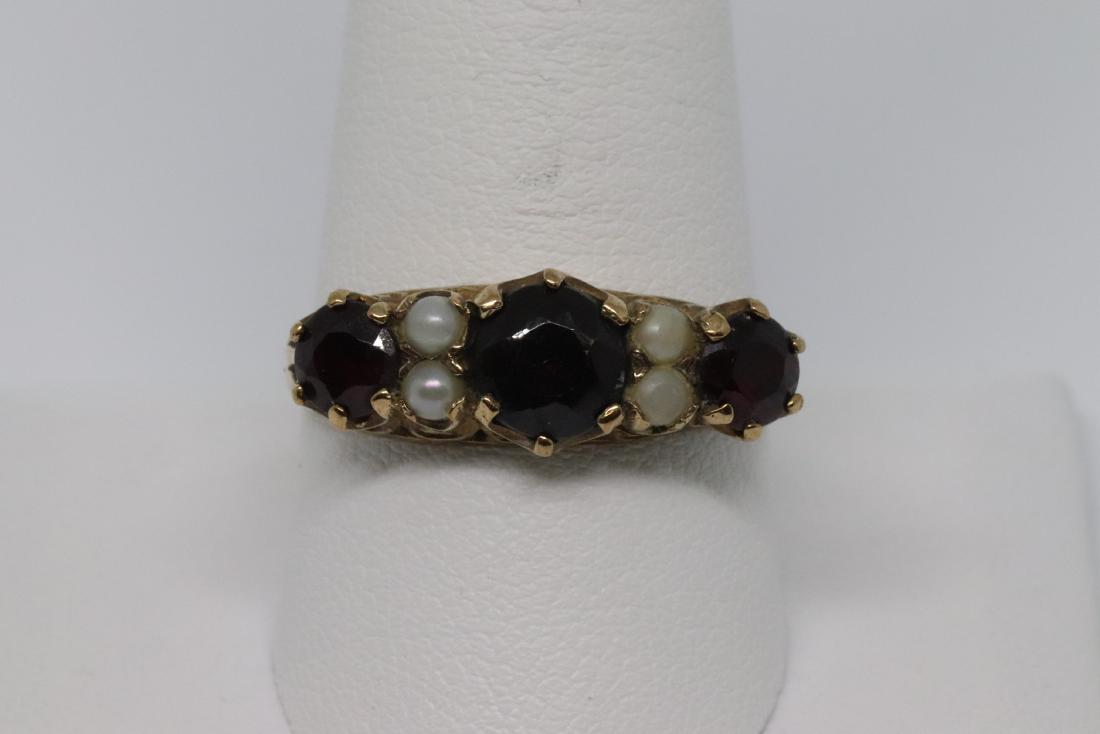 Art Deco Garnet/Pearl Ring: A Unique one of a kind Art Deco Yellow Gold Ring. The ring has 3 Round Garnet Stone in the center and 4 Pearls in the center. The ring size is size 10.00. The markings inside are " FM 375 9 ". SKU03J3