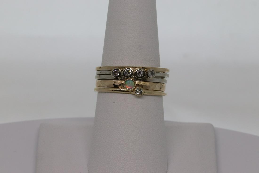 14kt Diamond Stackable Rings: A beautiful 14kt yellow gold with diamonds and Opal stones. These stackable rings are attached together and the diamonds are set in the center. There are a total of 5 round brilliant diamonds and a Ro