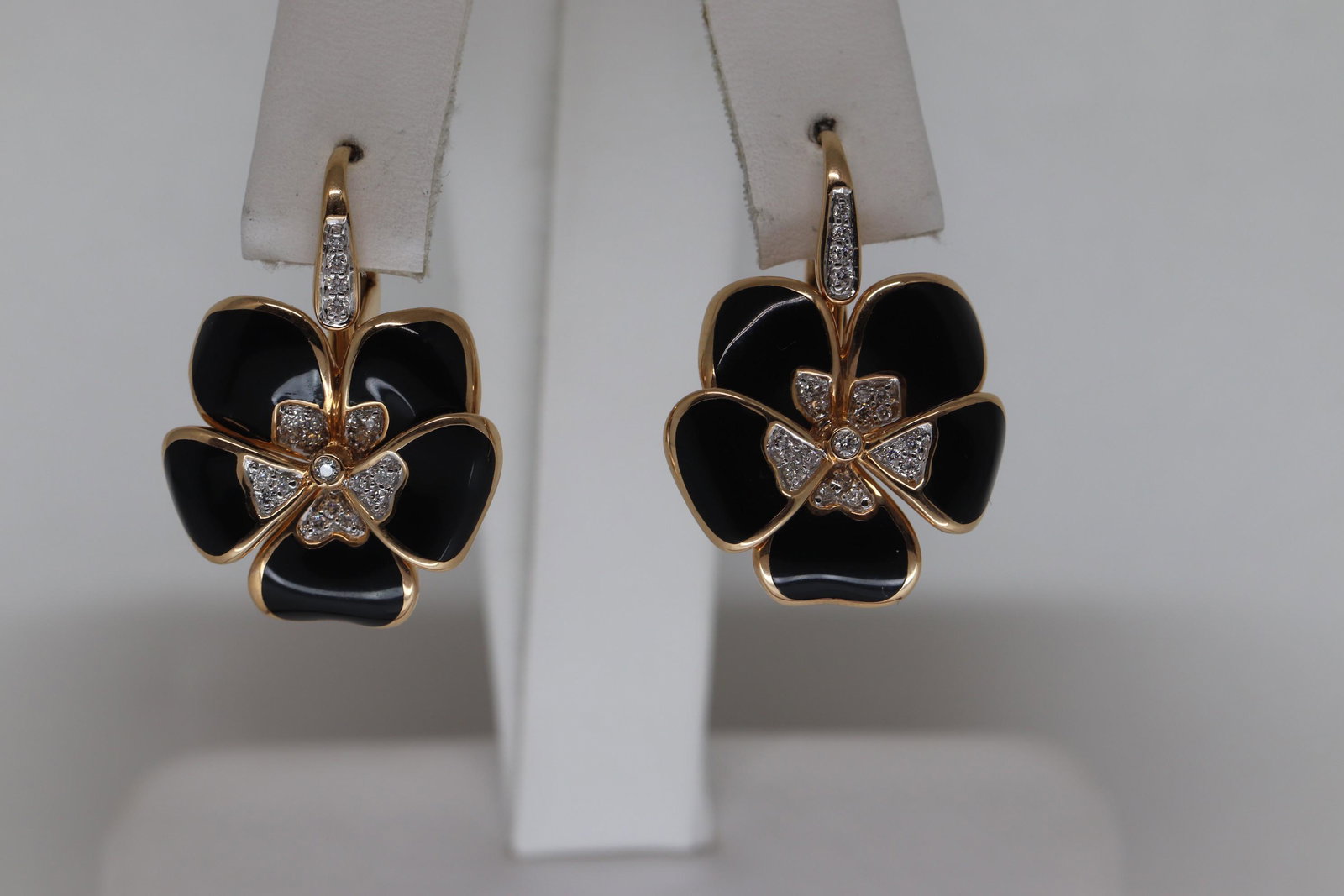 18KT Black Enamel And Diamond Flower Drop: A beautiful pair of 18kt Yellow Gold diamond earrings we made by Italian Designer Rosato. The earrings featured with blackEnamel. The earrings has a total weight of approx 0.20cttw in round brilliant 