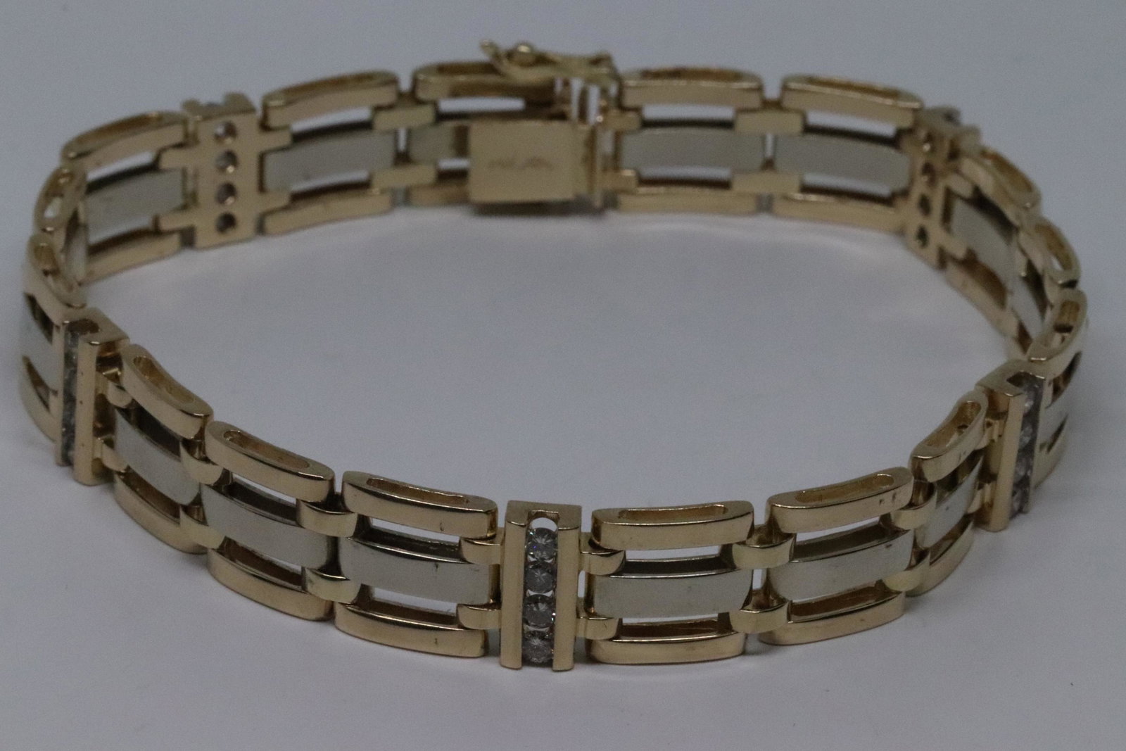 Men's Diamond Bracalet: 14 karat Yellow Gold diamond bracalet with a total of 20 round brilliant diamonds. The diamonds VS1-VS2 clarity. The total weight of the diamonds is approx 0.75-0.90tcw. The bracalet measures 8in. And