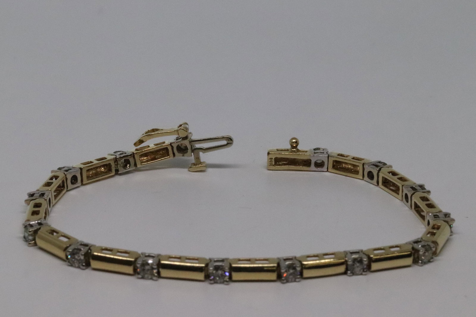 14Kt Diamond Bracalet: Gorgeous 14Kt Yellow Gold diamond bracalet. There are a total of 15 round brilliant diamonds which are VS2-SI1 clarity. The total weight of the diamonds are approx 1.75tcw. Total weight of the bracale