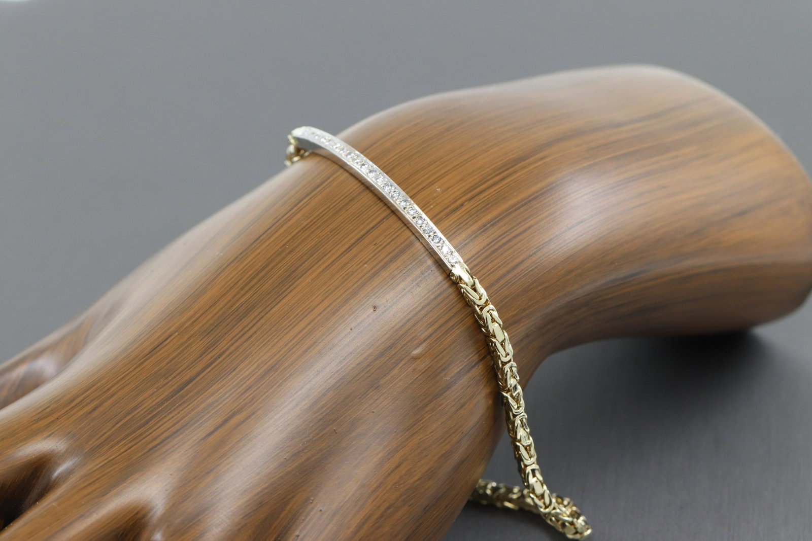 14Kt Ladies Diamond Bracelet: A ladies 14kt Yellow Gold Diamond bracelet. The bracelet has a total of 21 round brilliant diamonds. The diamonds are VS-SI clarity. The length is 8.00". Total weight of this 14kt yellow gold bracelet