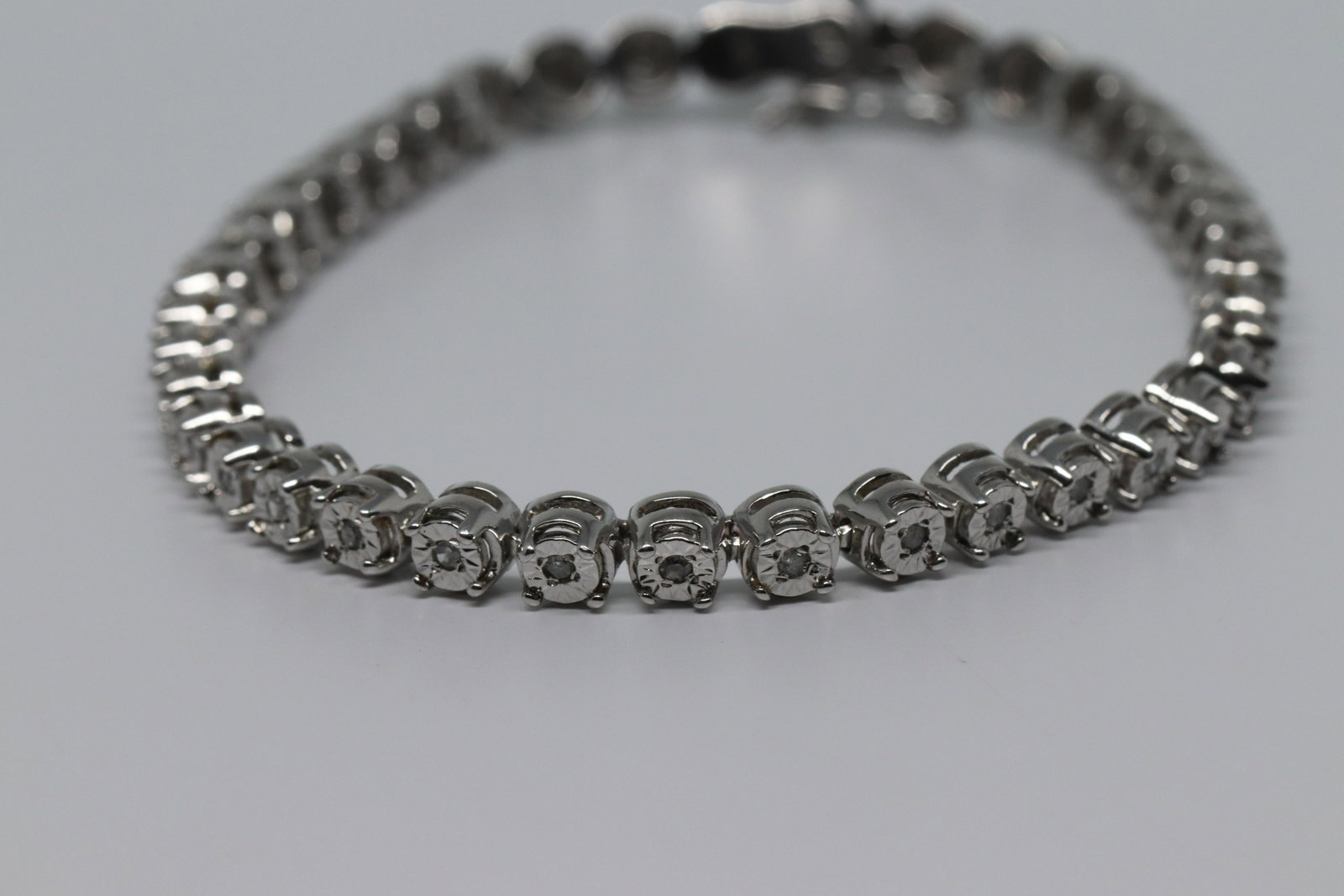 Ladies 925 Diamond Bracelet: This is a Ladies Ladies 925 Diamond Bracelet. This bracelet is in very good condition. The bracelet has a total of 40 diamonds set all around the bracelet. Bracelet total weight is. 11.1g.