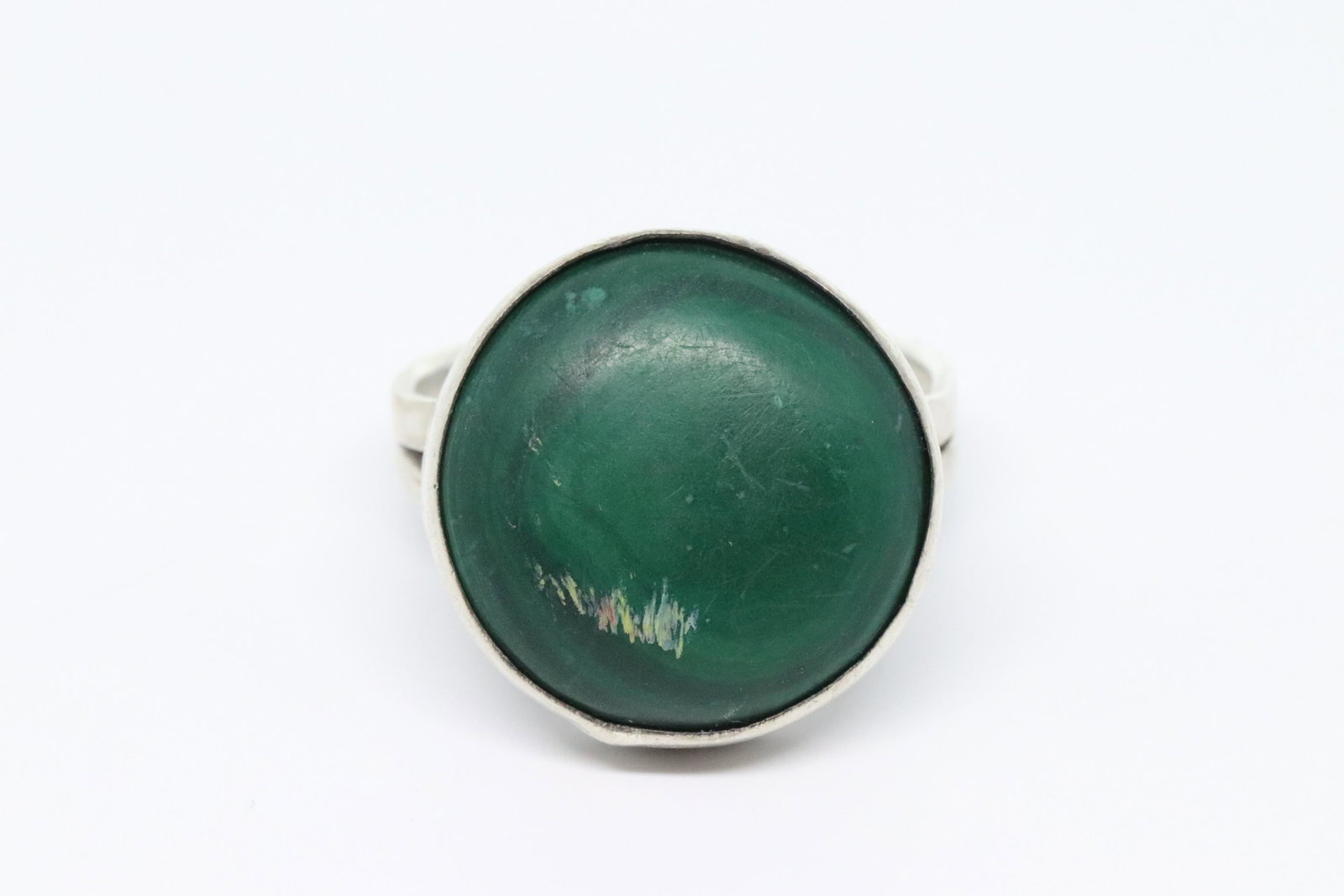 925 Silver Ring: This is a 925 Silver Ring. This ring has a center green stone not tested. Ring size is 8. total ring weight is 9.3g.